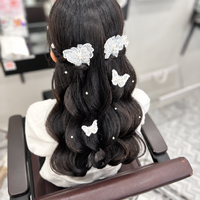 画像11890：花飾り低めシニヨン｜梅田・北新地ヘアセット
